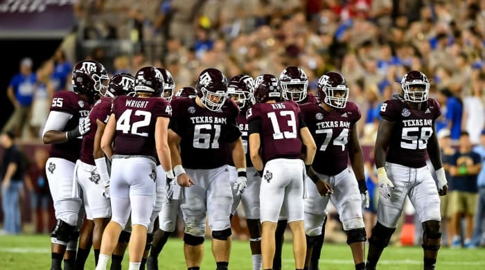 Sep 4, 2021; College Station, Texas, USA; Texas A&M Aggies quarterback Haynes King (13) in the huddle with offensive lineman Bryce Foster (61), offensive lineman Jahmir Johnson (58), offensive lineman Aki Ogunbiyi (74) and tight end Max Wright (42) during the fourth quarter against the Kent State Golden Flashes at Kyle Field.